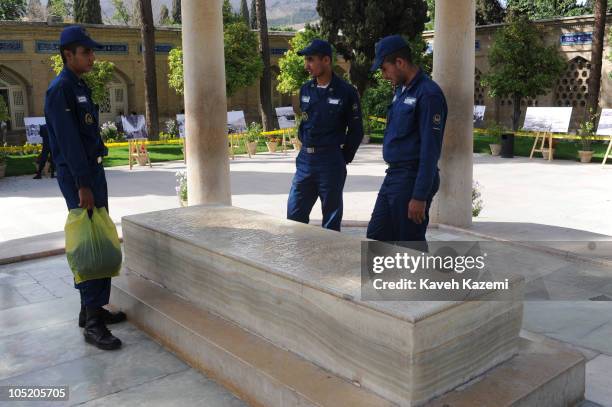 Soldiers in uniform make a wish at the Hafezieh, the mausoleum of 14th century Persian mystic Diwan Hafez, in Shiraz, 20th May 2009.