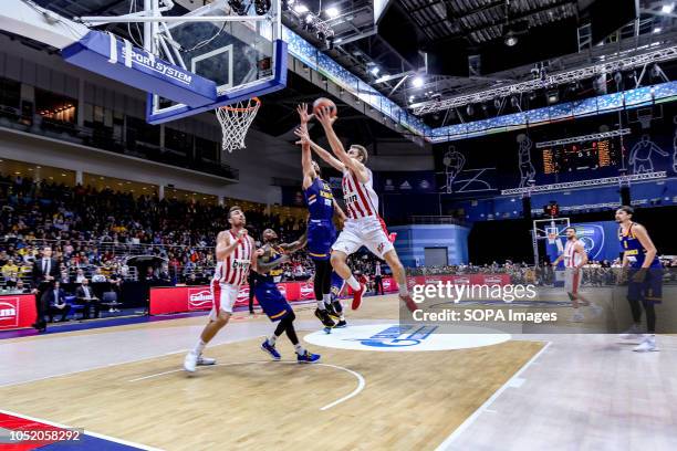 Janis Strelnieks, #13 of Olympiacos Piraeus in action against Anthony Gill of Khimki Moscow in the Turkish Airlines Euroleague Opening round of the...