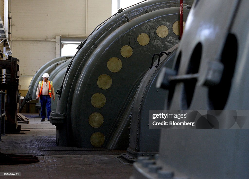 Dave Barrett, supervisor of hydro generation, walks past a 13... News ...