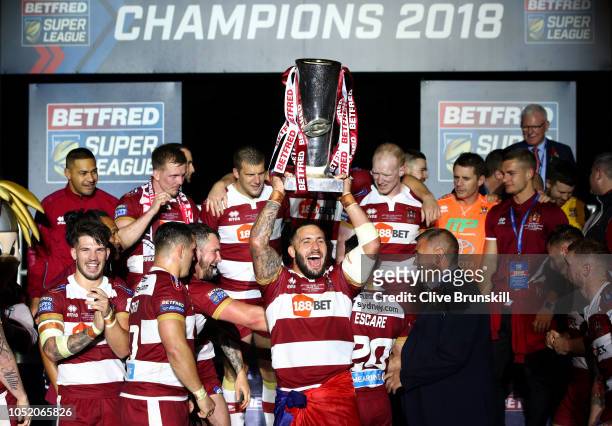 Romain Navarrete of Wigan Warriors celebrates with the trophy following victory in the BetFred Super League Grand Final between Warrington Wolves and...