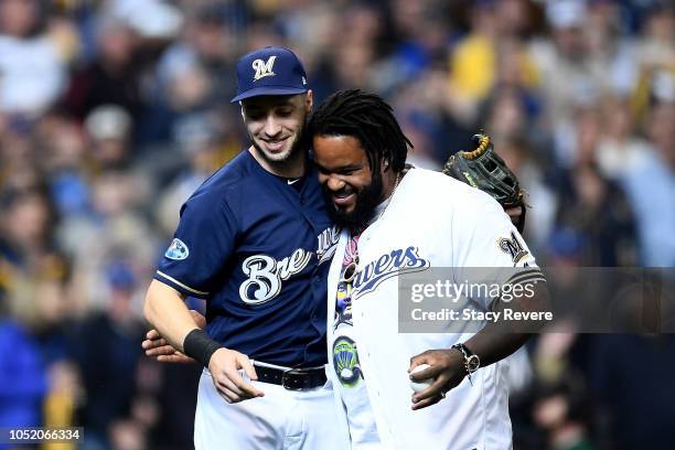 Former baseball player Prince Fielder and Ryan Braun of the Milwaukee Brewers joke around after throwing out the first pitch prior to Game Two of the...