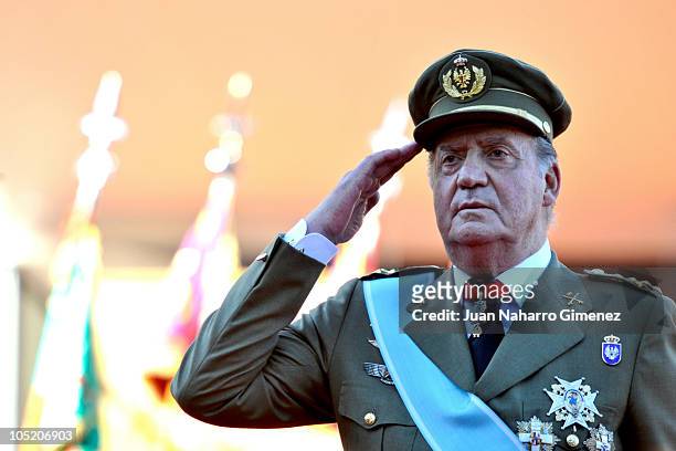 King Juan Carlos I of Spain salutes during National Day Military Parade in the Paseo de la Castellana on October 12, 2010 in Madrid, Spain.
