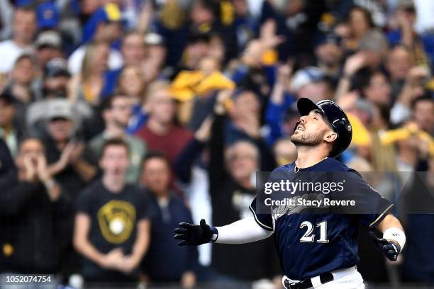 Travis Shaw of the Milwaukee Brewers celebrates after hitting a solo home run against Alex Wood of the Los Angeles Dodgers during the sixth inning in...