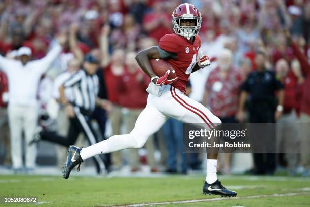 Jerry Jeudy of the Alabama Crimson Tide heads for the end zone with an 81-yard touchdown catch and run in the first quarter of the game against the...