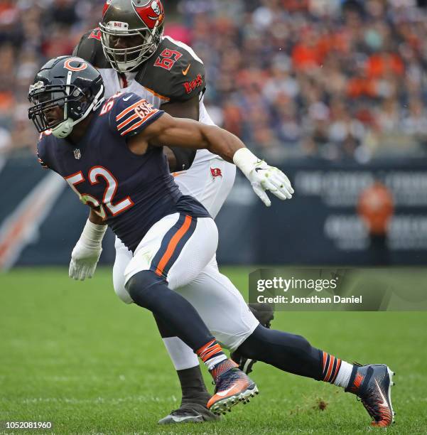 Khalil Mack of the Chicago Bears rushes past Demar Dotson of the Tampa Bay Buccaneers at Soldier Field on September 30, 2018 in Chicago, Illinois....