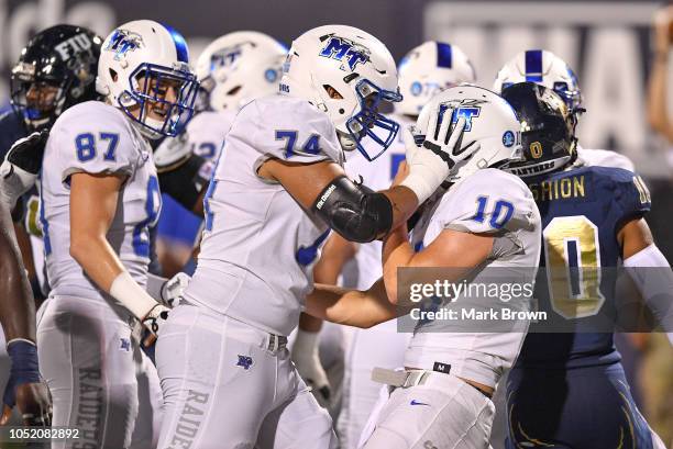 Asher O'Hara of the Middle Tennessee Blue Raiders celebrates a touchdown with Robert Behanan after scoring a touchdown in the first half against the...