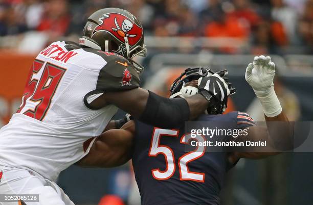 Khalil Mack of the Chicago Bears is illegeally blocked by Demar Dotson of the Tampa Bay Buccaneers at Soldier Field on September 30, 2018 in Chicago,...