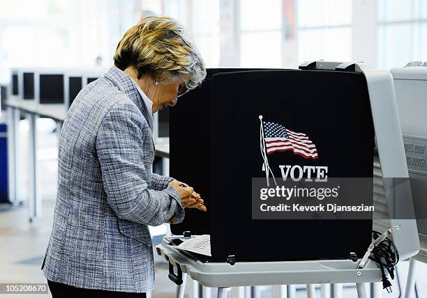 Sen. Barbara Boxer casts her vote during early voting for the California midterm election at the Riverside County Registrar's Office on October 12,...