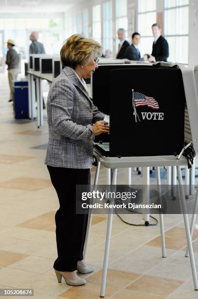 Sen. Barbara Boxer casts her vote during early voting for the California midterm election at the Riverside County Registrar's Office on October 12,...