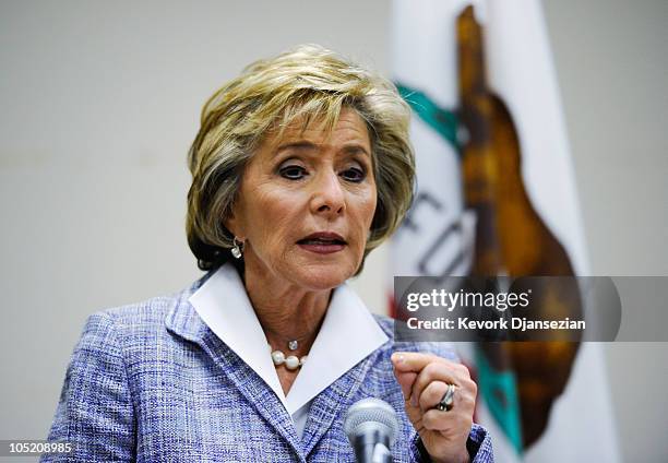 Sen. Barbara Boxer speaks at a news conference after casting her vote during early voting for the California midterm election at the Riverside County...