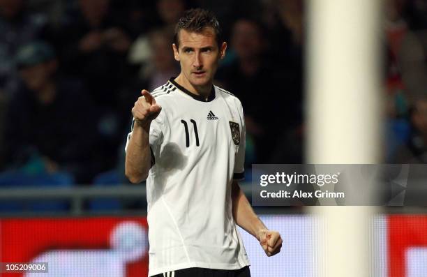 Miroslav Klose of Germany celebrates his team's first goal during the EURO 2012 group A qualifier match between Kazakhstan and Germany at the Astana...