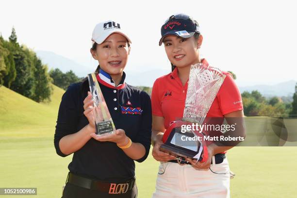 Yu-Chiang Hou of Taiwan and Yui Kawamoto of Japan pose during the trophy presentation of the Udonken Ladies at Mannou Hills Country Club on October...