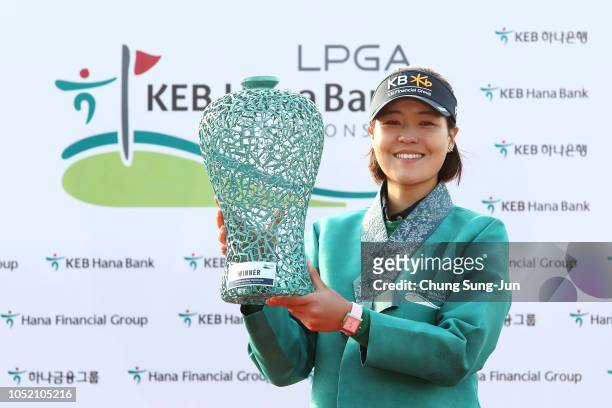 In-Gee Chun of South Korea holding the trophy on the 18th green after winning the LPGA KEB Hana Bank Championship at Sky 72 Golf Club on October 14,...
