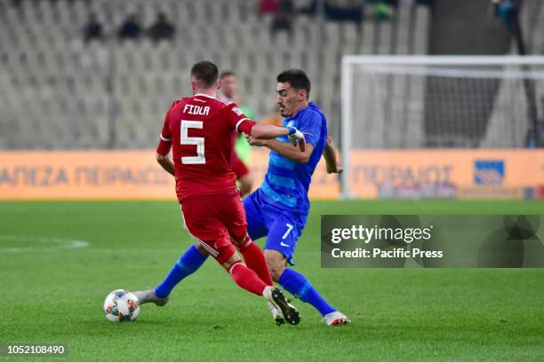 Lazaros Christodoulopoulos of Greece, tries to avoid Attila Fiola of Hungary during UEFA Nations League Greece vs Hungary. Greece won 1-0.