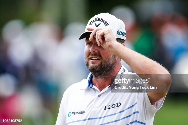 Marc Leishman of Australia acknowledges the crowd on the 18th hole during the final round of the CIMB Classic at TPC Kuala Lumpur on October 14, 2018...