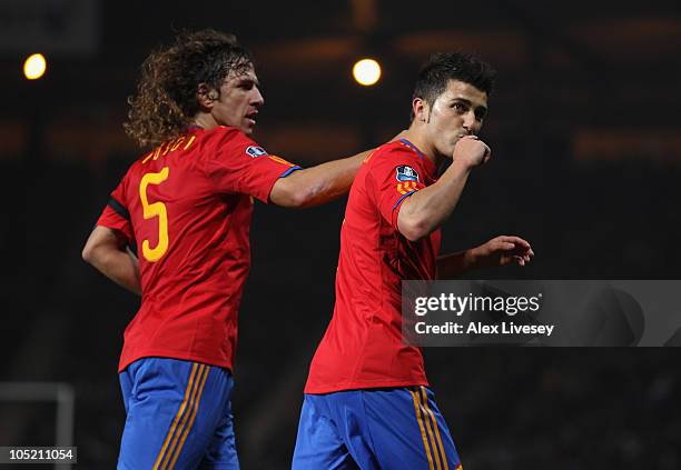 David Villa of Spain celebrates with Carles Puyol after scoring the opening goal from the penalty spot during the UEFA EURO 2012 Group I Qualifier...