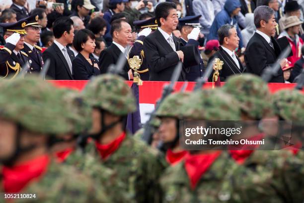 Japanese Prime Minister Shinzo Abe and Defense Minister Takeshi Iwaya review troops of the country's Self Defense Forces during the annual review at...