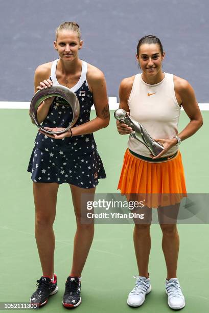 Champion winner Caroline Garcia of France and Runner-up Karolina Pliskova of Czech Republic pose with trophy during victory ceremony after the...