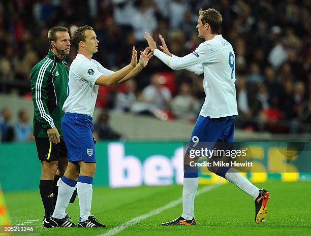 Kevin Davies of England comes on for Peter Crouch of England during the UEFA EURO 2012 Group G Qualifying match between England and Montenegro at...