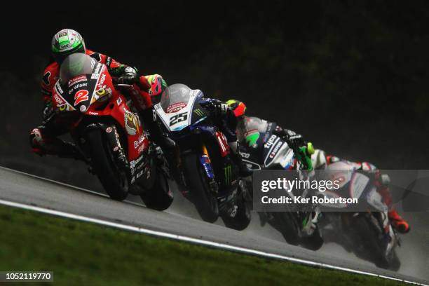 Glenn Irwin of Great Britain and the Be Wiser Ducati Racing Team leads a pack of riders during the British Superbike Championship at Brands Hatch on...