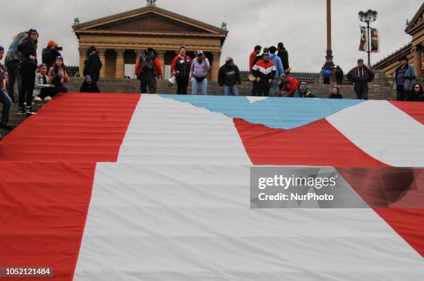 Puerto Rican Philadelphians and their supporters march to Remember Puerto Rican Victims of Colonialism in Philadelphia, PA, on 13 October 2018. They...