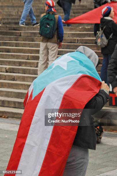 Puerto Rican Philadelphians and their supporters march to Remember Puerto Rican Victims of Colonialism in Philadelphia, PA, on 13 October 2018. They...