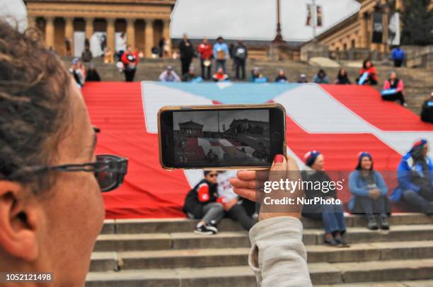 Puerto Rican Philadelphians and their supporters march to Remember Puerto Rican Victims of Colonialism in Philadelphia, PA, on 13 October 2018. They...