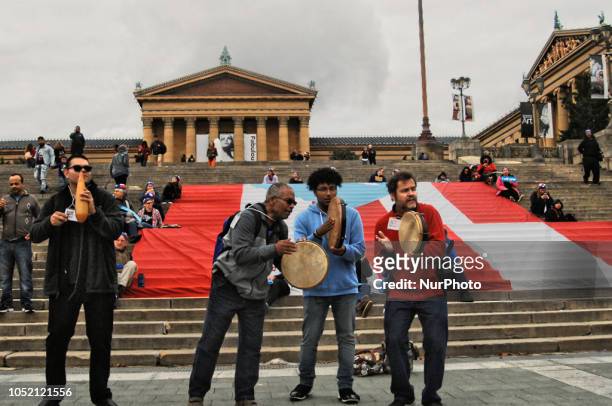 Puerto Rican Philadelphians and their supporters march to Remember Puerto Rican Victims of Colonialism in Philadelphia, PA, on 13 October 2018. They...