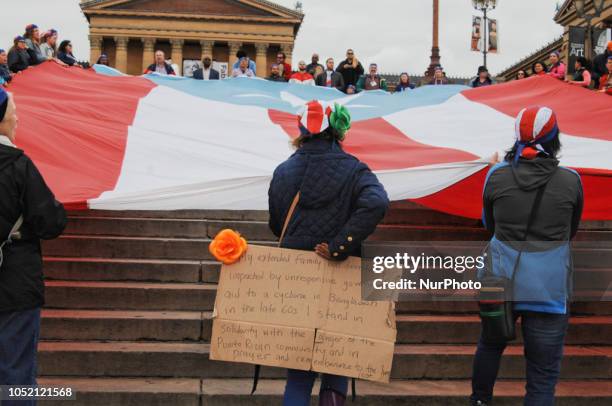 Puerto Rican Philadelphians and their supporters march to Remember Puerto Rican Victims of Colonialism in Philadelphia, PA, on 13 October 2018. They...