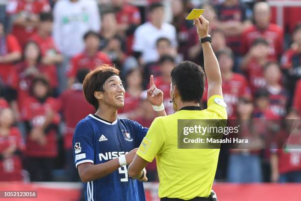 Yuki Otsu of Yokohama F.Marinos is shown a yellow card by referee during the J.League Levain Cup semi final second leg match between Yokohama...