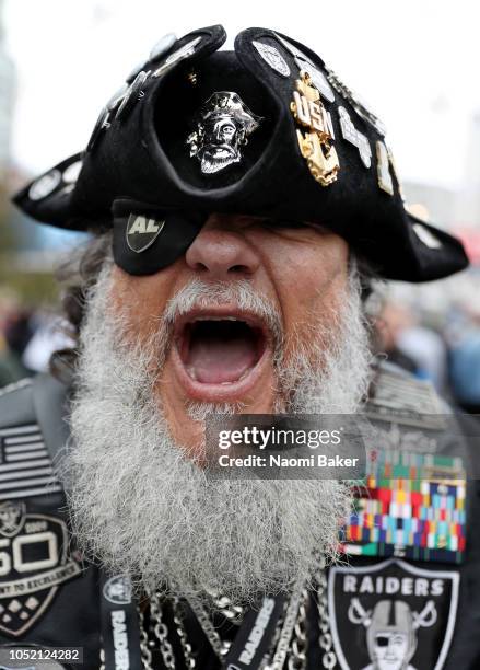 Oakland Raiders fan poses for a photograph ahead of the NFL International series match between Seattle Seahawks and Oakland Raiders at Wembley...