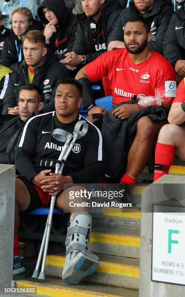 Billy Vunipola and his brother Mako Vunipola, who were injured in the match look on after being replaced during the Champions Cup match between...