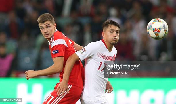 Russia's midfielder Roman Zobnin vies for the ball with Turkey's forward Cengiz Under during the UEFA Nations League football match between Russia...