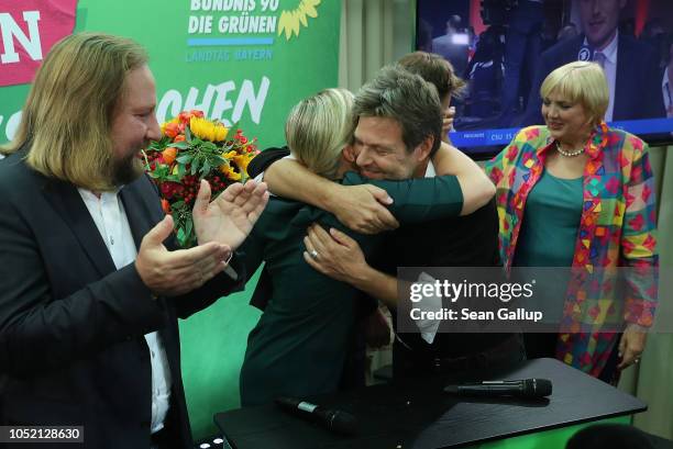 Katharina Schulze and Ludwig Hartmann, co-lead candidates of the German Greens Party , embrace leading Greens Party federal party members Anton...