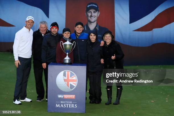 Eddie Pepperell of England pose for a photo with friends, family and host Justin Rose of England after winning the tournament during day four of Sky...