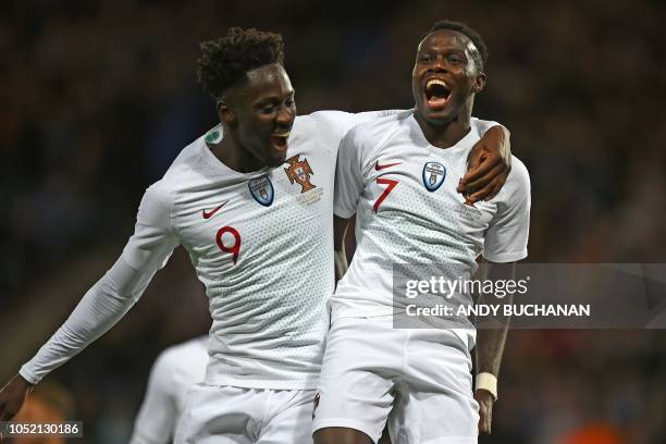 Portugal's striker Bruma celebrates with Portugal's striker Eder after scoring their third goal during the International friendly football match...