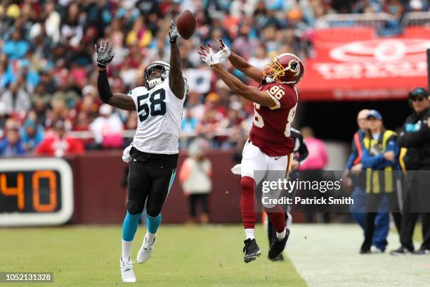 Linebacker Thomas Davis of the Carolina Panthers breaks up a pass to tight end Jordan Reed of the Washington Redskins in the first first quarter at...