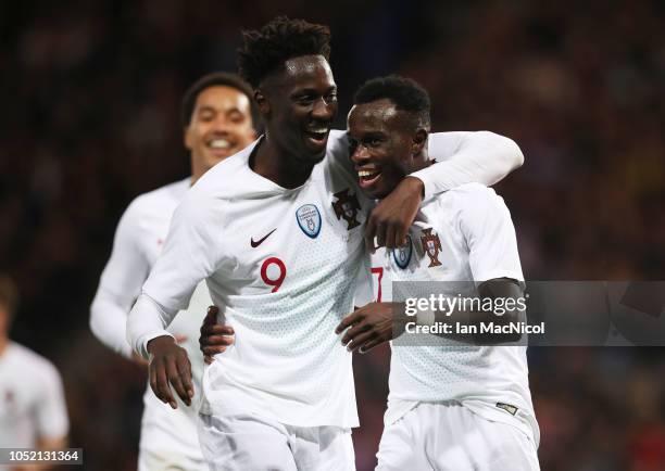 Bruma of Portugal celebrates with Eder after he scores his team's third goal during the International Friendly match between Scotland and Portugal on...