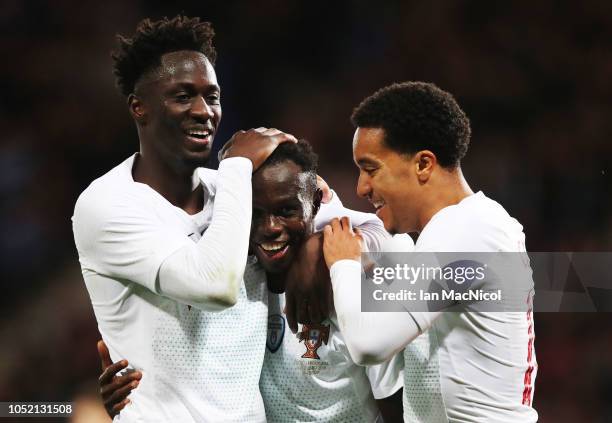 Bruma of Portugal celebrates with Eder and Helder Costa after he scores his team's third goal during the International Friendly match between...