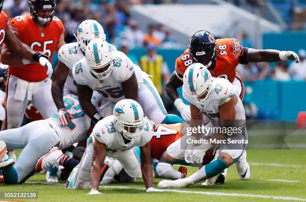 Kiko Alonso of the Miami Dolphins recovers a fumble by Jordan Howard of the Chicago Bears in the second quarter of the game at Hard Rock Stadium on...