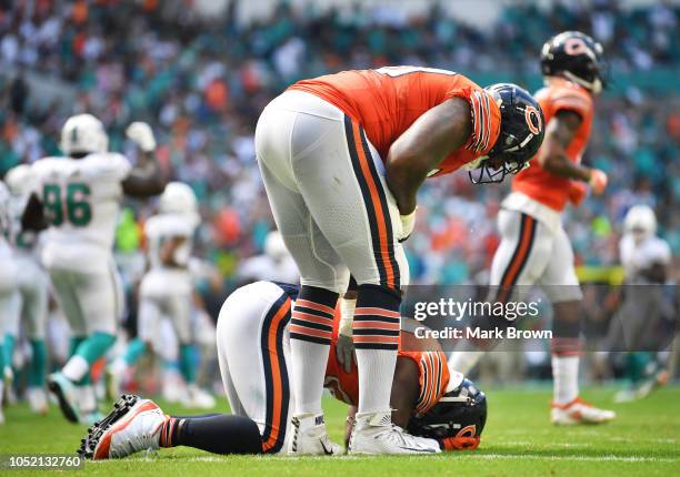 Jordan Howard of the Chicago Bears reacts after fumbling in the second quarter against the Miami Dolphins of the game at Hard Rock Stadium on October...