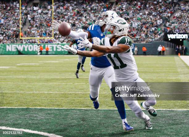 Defensive back Pierre Desir of the Indianapolis Colts breaks up a pass intended for wide receiver Robby Anderson of the New York Jets during the...