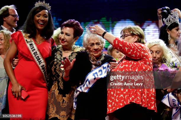 Holocaust survivor Tova Ringer celebrates after winning the annual Holocaust Survivors beauty pageant on October 14, 2018 in Haifa, Israel. The...
