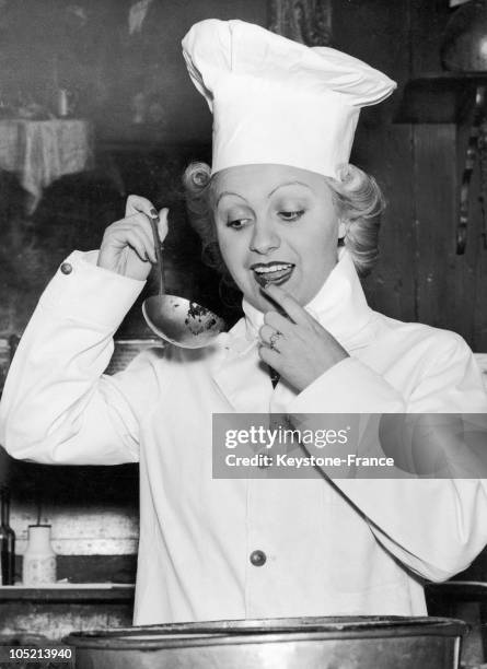 The Hungarian Actress Magda Kun Tasting The Famous English Pudding In The Cheshire Cheese Pub In Fleet Street, London. .