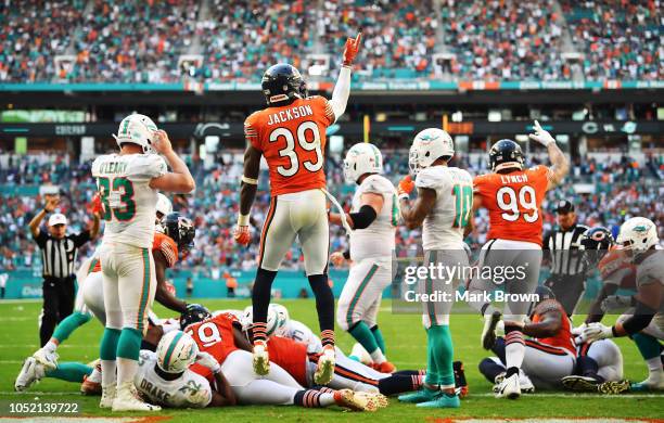 Eddie Jackson reacts after Eddie Goldman of the Chicago Bears recovered a fumble by Kenyan Drake of the Miami Dolphins in overtime during the game at...