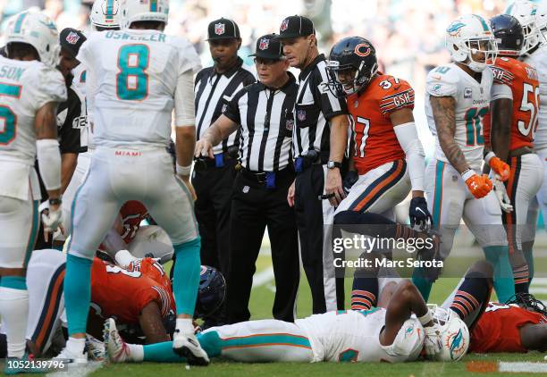 Kenyan Drake of the Miami Dolphins reacts after fumbling a ball recovered by Eddie Goldman of the Chicago Bears in overtime during the game at Hard...