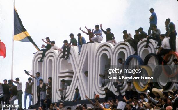 Mexican Spectators Perched Atop The Bleachers In Order To Better Appreciate The Processions During The Opening Ceremony Of The Olympic Summer Games...