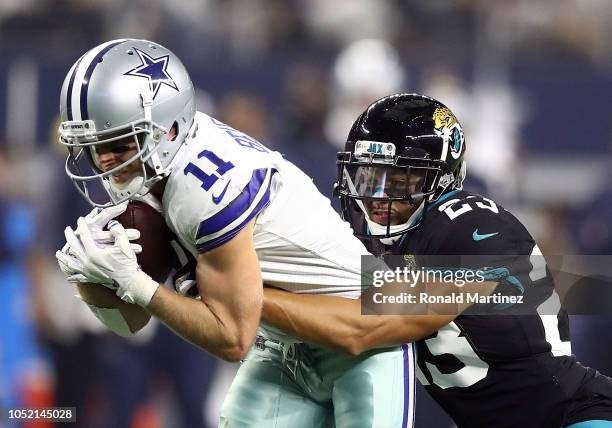 Cole Beasley of the Dallas Cowboys gets tackled by Tyler Patmon of the Jacksonville Jaguars in the second quarter of a game at AT&T Stadium on...