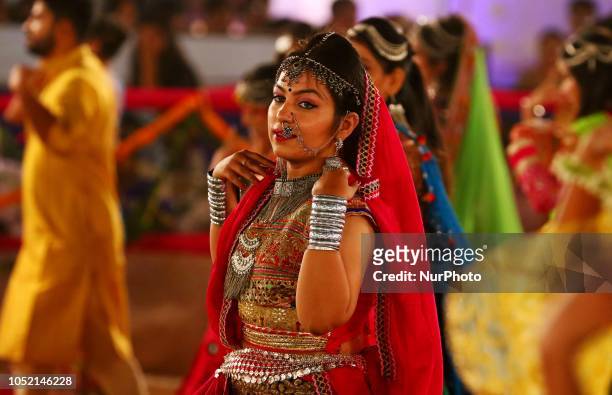Indian men and women perform Garba &amp; Dandiya dance during the Navratri festival 'nine days' celebration in Jaipur,Rajasthan,India on Oct...