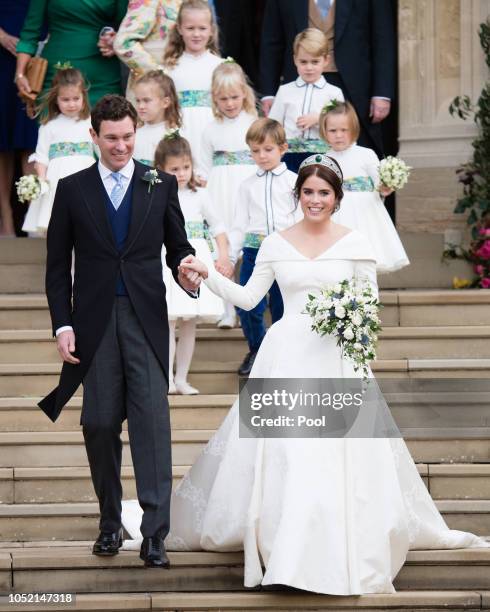 Princess Eugenie of York and Jack Brooksbank leave St George's Chapel in Windsor Castle following their wedding at St. George's Chapel on October 12,...